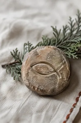Weathered Ichthys Stone on Evergreen Linen