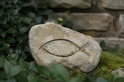 Ichthys Carving on Weathered Garden Stone