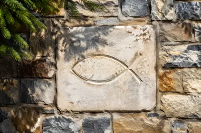 Carved Ichthys Symbol on Weathered Limestone