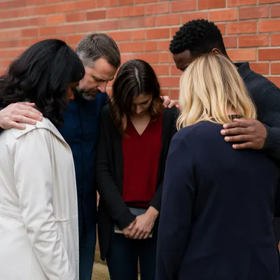 Outdoor Intercessory Prayer Circle by Brick Wall