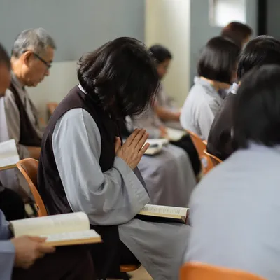 Quiet Intercessory Prayer Circle in Community Hall