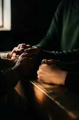 Intercessory Prayer Hands in Quiet Chapel