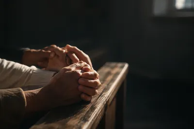 Intercessory Prayer Hands in Chapel Light