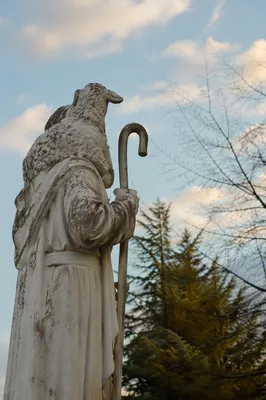 Good Shepherd Statue With Lamb Outdoors