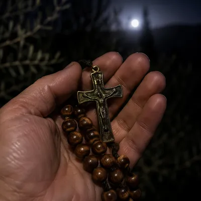 Crucifix and Prayer Beads at Night