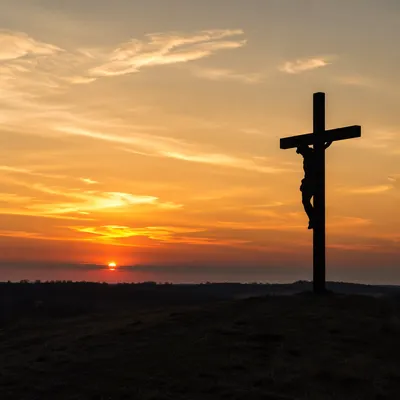 Jesus Silhouette on Cross at Sunset