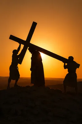 Jesus Silhouette Carrying Cross at Sunset