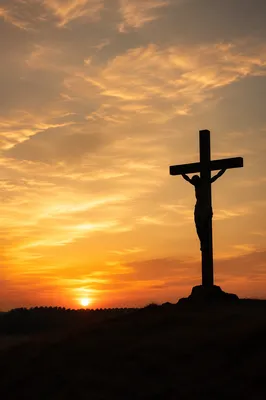 Jesus Silhouette on Cross at Sunset