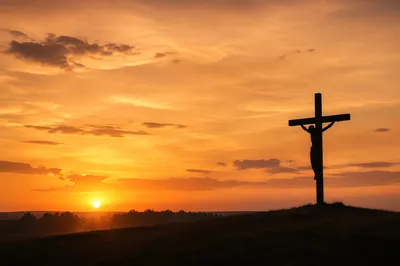 Jesus Silhouette on Cross at Sunset
