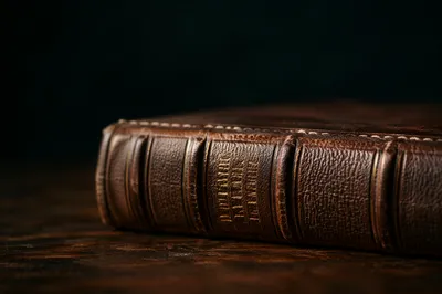 Leather Bible on Dark Wooden Table