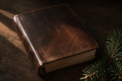 Leather Bible on Dark Walnut Table