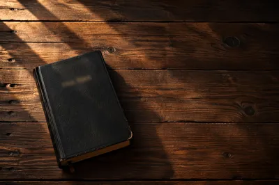 Leather Bible on Dark Rustic Wood