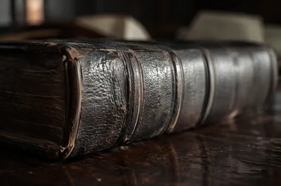 Antique Leather Bible on Dark Wood