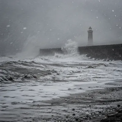 Lighthouse Beacon Through Stormy Coastal Mist