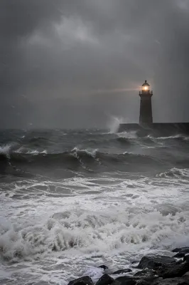 Lighthouse Beacon Through Coastal Storm