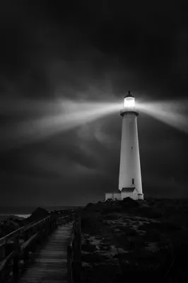 Stormy Lighthouse Beacon Over Dark Coast