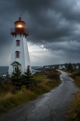 Lighthouse Beacon Through Stormy Coastal Winds