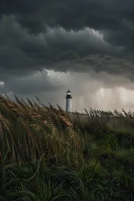 Lighthouse Beacon Beneath Incoming Coastal Storm