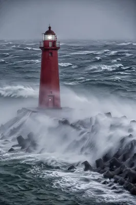 Red Lighthouse Beacon Through Coastal Storm