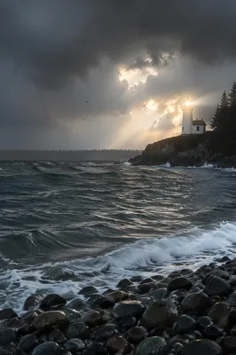 Lighthouse Beacon Through Stormy Coastal Waters