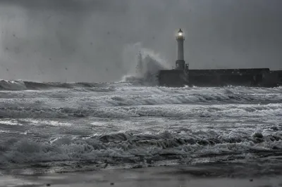 Lighthouse Beacon Through a Stormy Coast