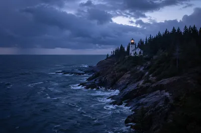 Evergreen Lighthouse Beacon in Storm Twilight