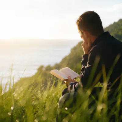Man Reading Bible in Morning Light