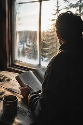 Man Reading Bible in Morning Cabin Light