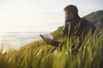 Man Reading Bible in Morning Light
