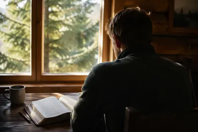 Morning Bible Reading in a Quiet Cabin