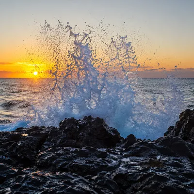 Sunrise Waves Crashing on Volcanic Rocks