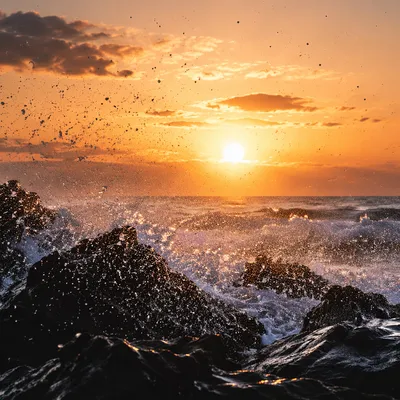Sunrise Waves Crashing on Coastal Rocks