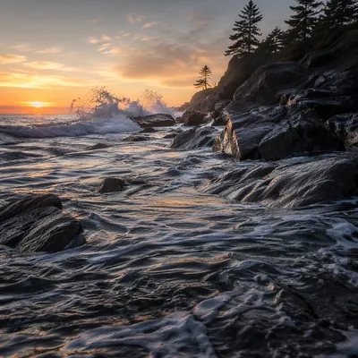 Sunrise Waves Crashing on Rocky Shoreline
