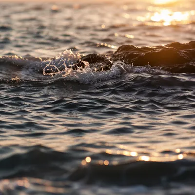 Sunrise Waves Breaking on Coastal Rocks