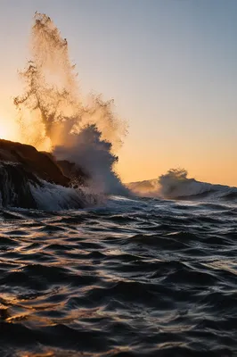Sunrise Waves Crashing on Coastal Rocks