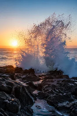 Sunrise Wave Crashing on Volcanic Rocks