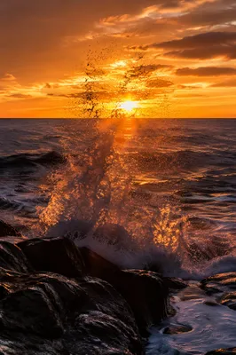 Sunrise Waves Crashing on Coastal Rocks