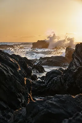 Sunrise Waves Crashing on Volcanic Rocks