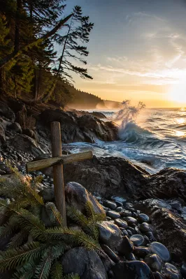 Driftwood Cross by Sunrise Ocean Waves