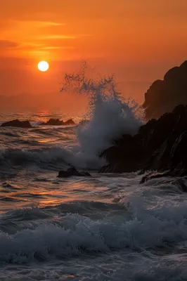 Sunrise Waves Crashing on Volcanic Rocks