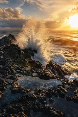 Sunrise Waves Crashing on Volcanic Rocks
