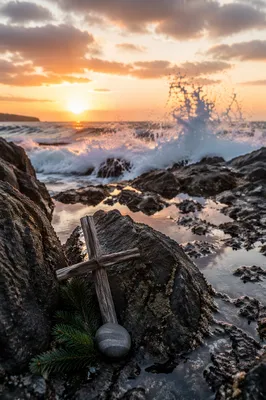 Driftwood Cross by Sunrise Ocean Waves