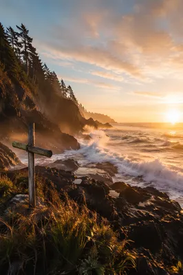 Driftwood Cross by Sunrise Ocean Waves