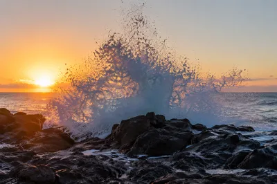 Sunrise Waves Crashing on Volcanic Rocks