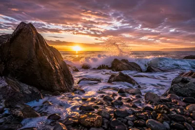 Ocean Waves Crashing on Sunrise Rocks