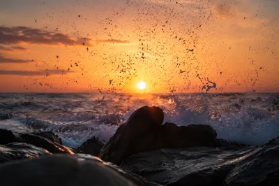 Sunrise Waves Crashing on Jagged Rocks