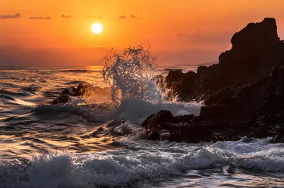 Sunrise Waves Crashing on Volcanic Rocks