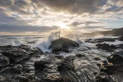 Sunrise Waves Crashing on Volcanic Rocks