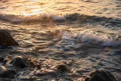 Golden Sunrise Waves on Rocky Shore