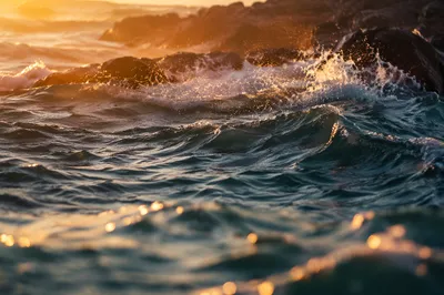 Sunrise Waves Breaking Over Coastal Rocks
